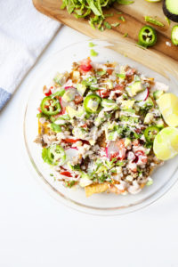 Nachos made with home-baked tortilla chips made from extra thin lower carb tortillas- you can have a whole dish and still eat light!