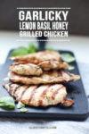 Grilled basil chicken breasts on cutting board