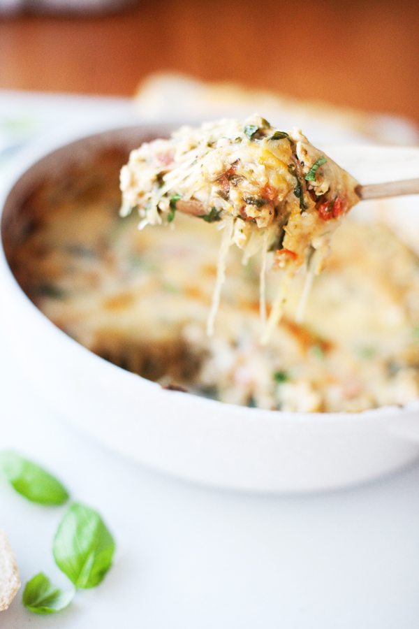 Taking a scoop of cheesy spaghetti squash bake