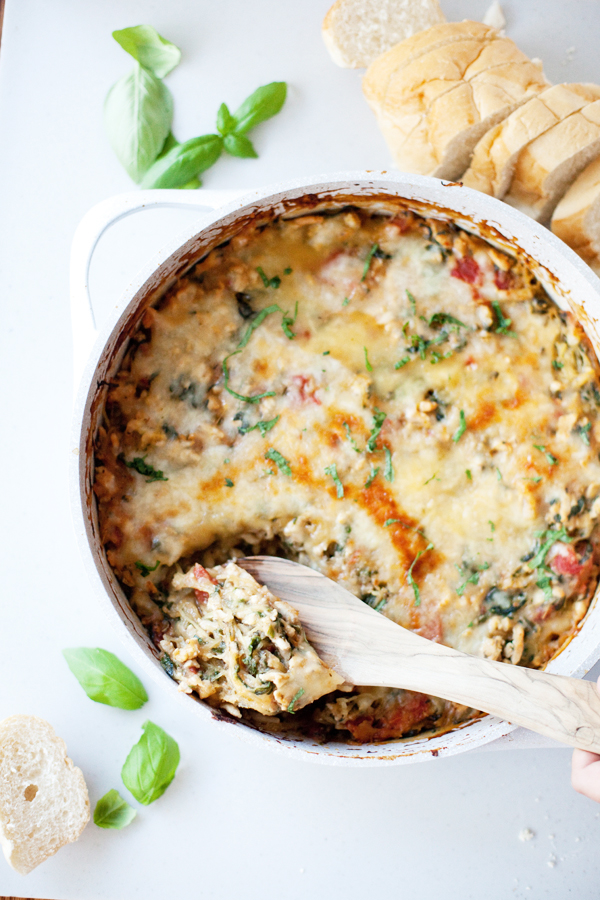 Taking a scoop of cheesy spaghetti squash bake
