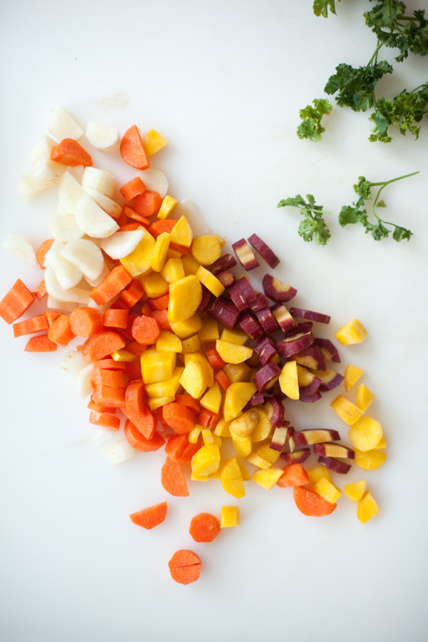 Cutting board of chopped rainbow carrots