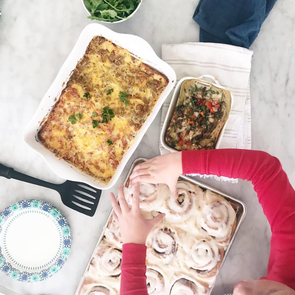 Breakfast casseroles and cinnamon rolls on the table