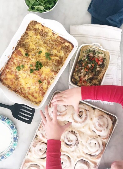 Breakfast casseroles and cinnamon rolls on the table