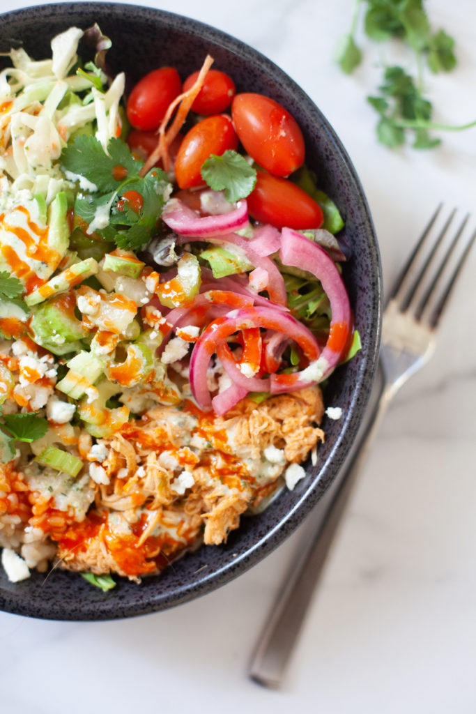 Quick and easy buffalo chicken grain salad bowl. www.lillieeatsandtellscom.bigscoots-staging.com
