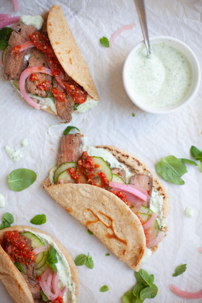 Steak Pitas with whipped herb feta and romesco sauce www.lillieeatsandtellscom.bigscoots-staging.com