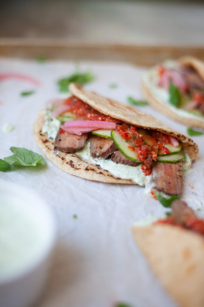 These steak and romesco sauce pitas are perfect for feeding a crowd! www.lillieeatsandtellscom.bigscoots-staging.com