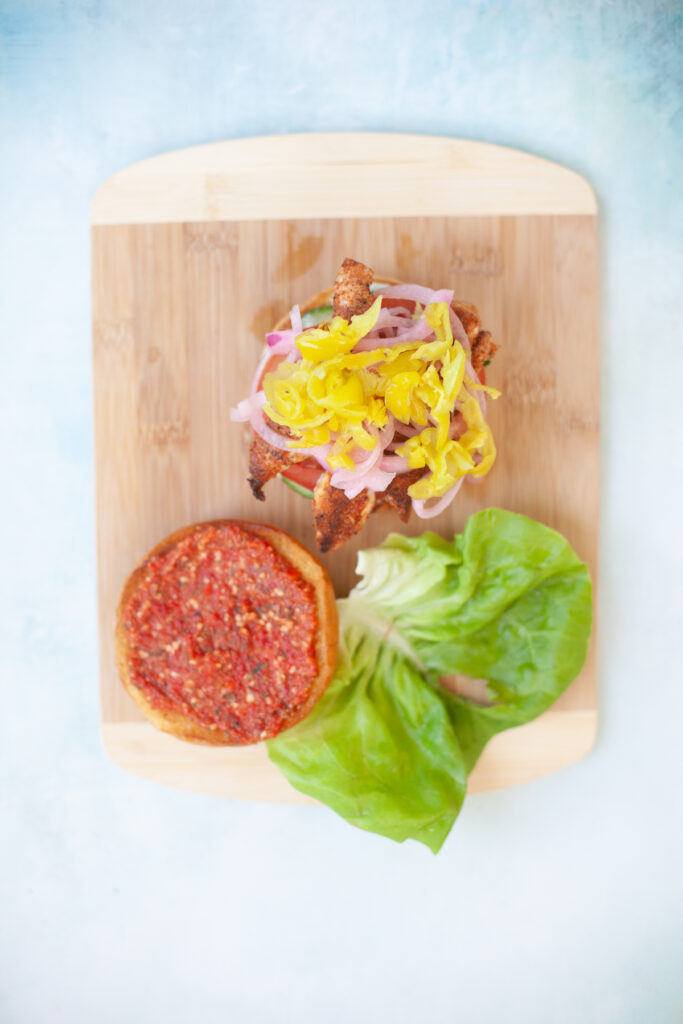 blackened chicken sandwich with romesco sauce from www.lillieeatsandtellscom.bigscoots-staging.com