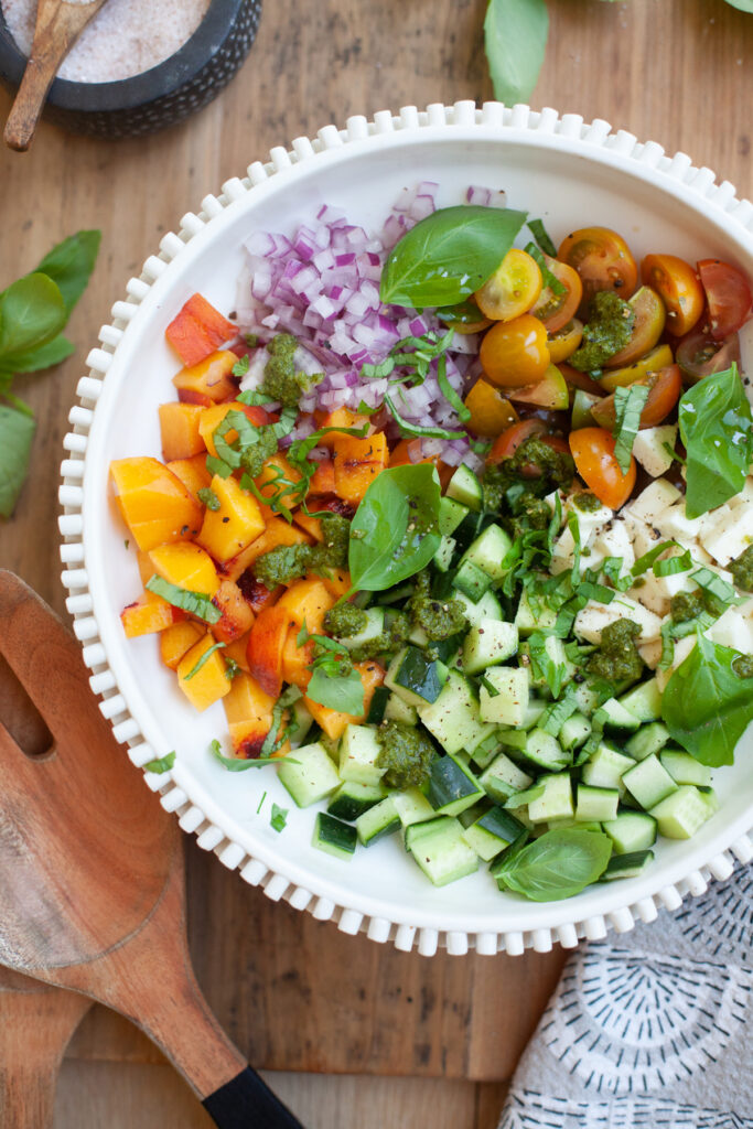 baker and olive white balsamic vinegar served on a peach chopped caprese salad by www.lillieeatsandtellscom.bigscoots-staging.com