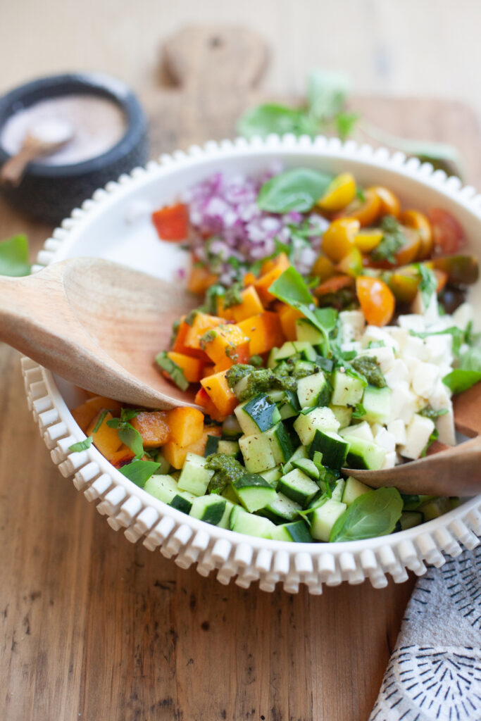 baker and olive white balsamic vinegar served on a peach chopped caprese salad by www.lillieeatsandtellscom.bigscoots-staging.com