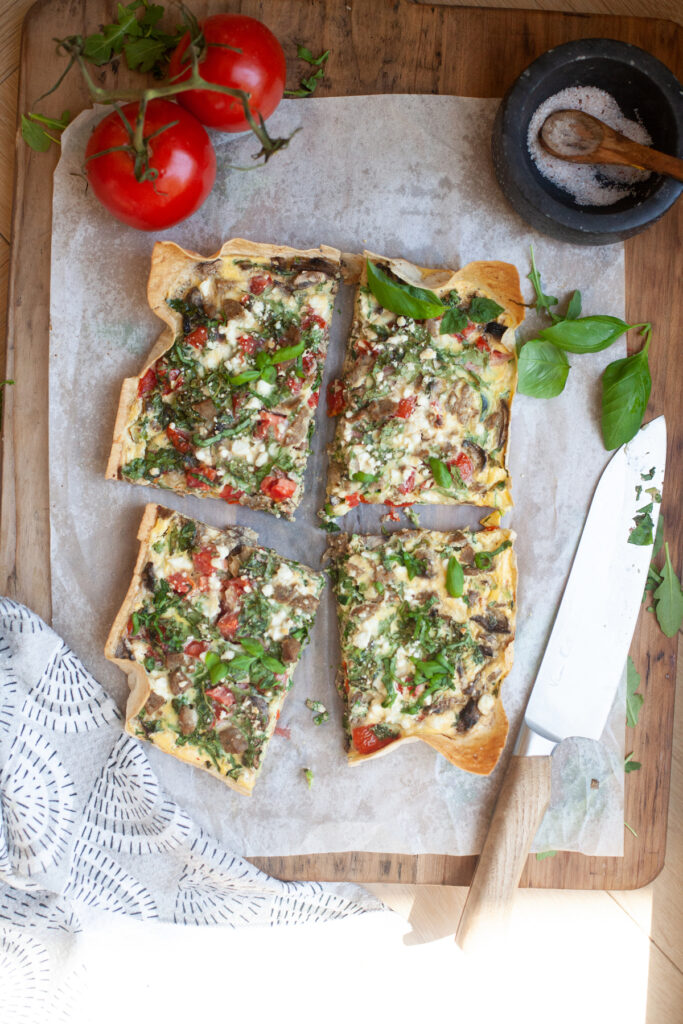 Garden Veggie Quiche for One cut into quarters | recipe by www.lillieeatsandtellscom.bigscoots-staging.com